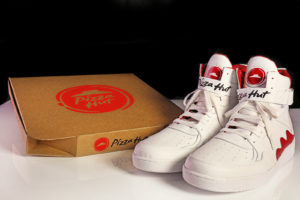 Pie Top sneakers next to a Pizza Hut Box